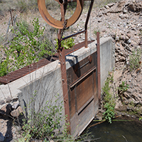 Head gate along irrigation ditch along the Gila River. Photo Credits: Mary Harner