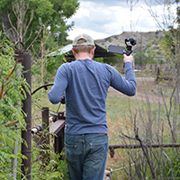 Rosdail balancing while filming and crossing an irrigation ditch along the Gila River. Photo Credits: Mary Harner