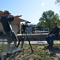 Jacob Rosdail setting up from an interview with Jerry Woodrow. Photo Credits: Mary Harner